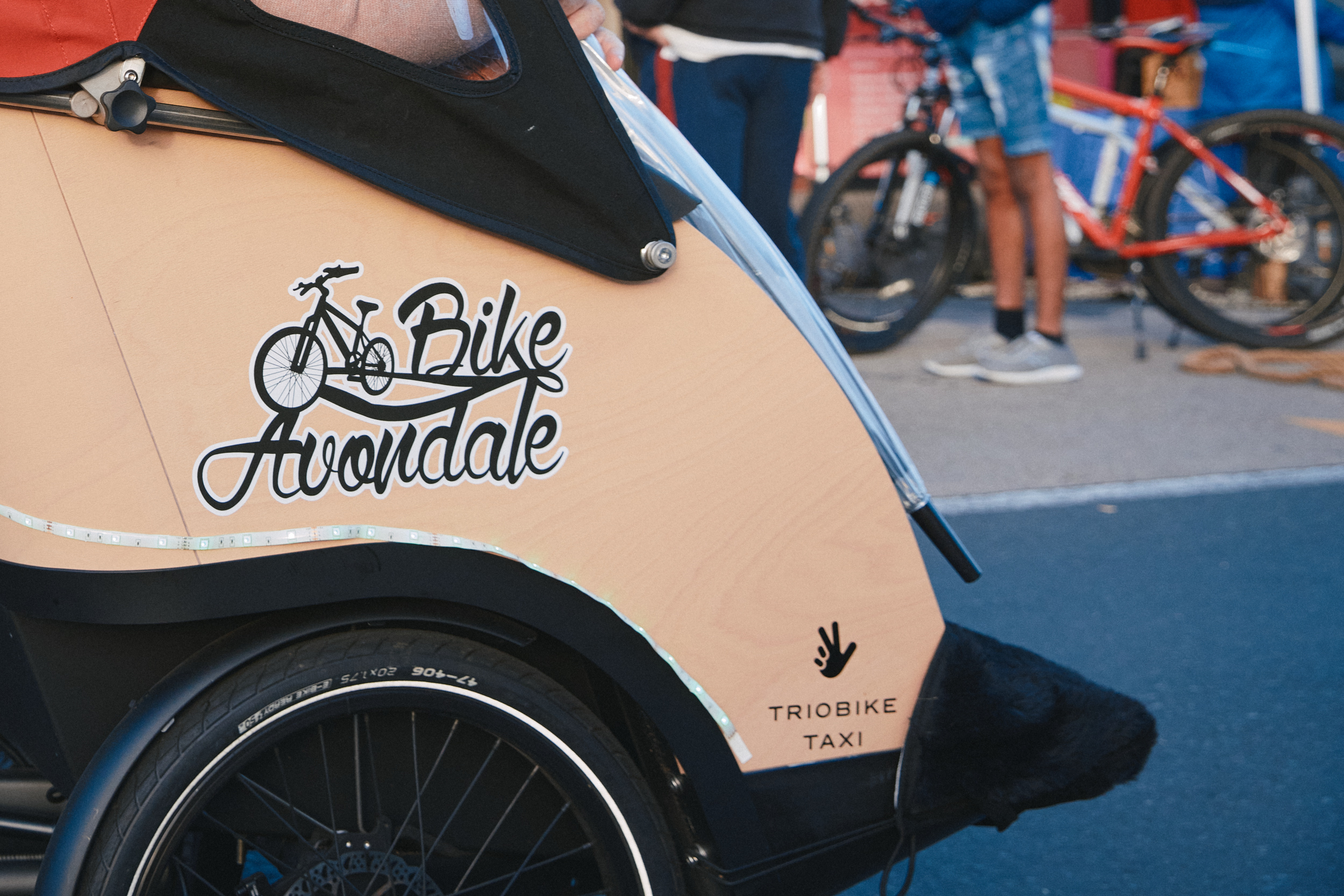 Back portion of tri-shaw bicycle with Bike Avondale logo on it